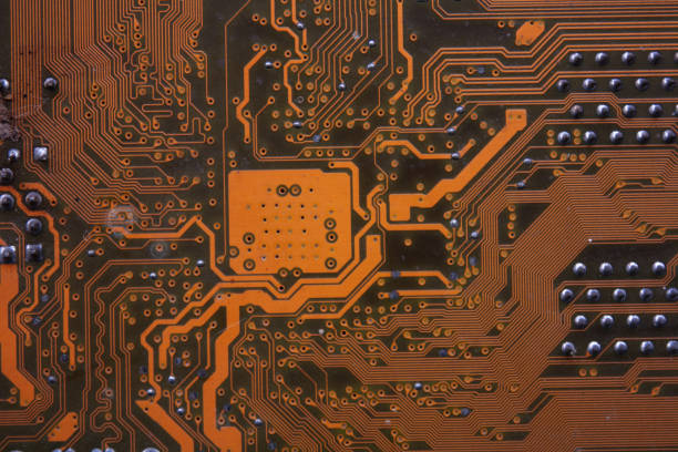 istock The copper pattern on the back of an electronic circuit board or a computer motherboard. 1315888532