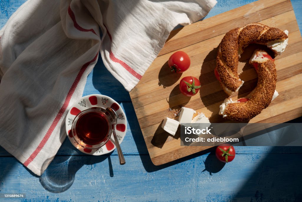 Turkish bagel with cheese, tomato, tea Turkish Bagel Stock Photo