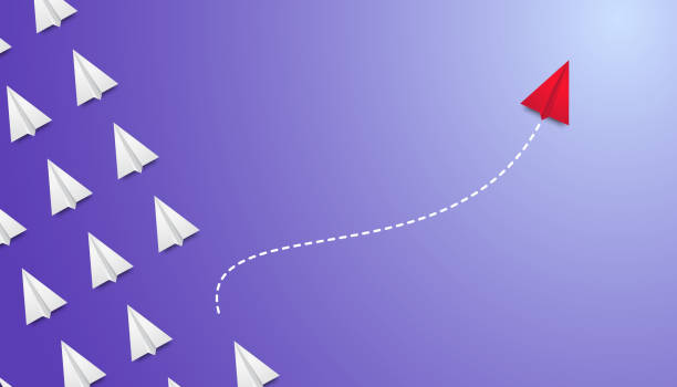 istock Red plane changes direction, leadership. Individual and unique leader red paper plane flies to the side. New idea, change, courage, innovation concept, new thinking with airplane, creative decision. 1315893036