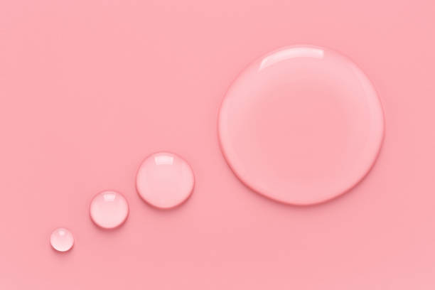 istock Water drops in speech bubble shape on pink background. 1315893049