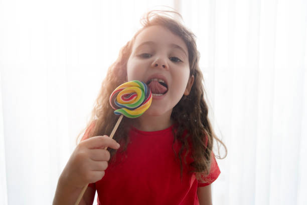 istock Little girl with candy 1315894465