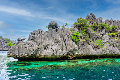Twin Lagoon on paradise island with sharp limestone rocks, tropical travel destination - Coron, Palawan, Philippines.