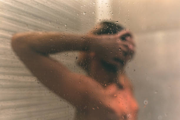 istock man taking a shower in a hotel room 1315902100