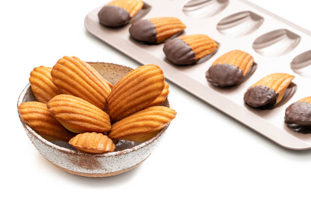 istock Madeleines Homemade bowl and melted chocolate in a mold isolated on white 1315904871