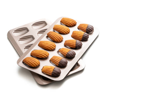 istock Madeleines Homemade and melted chocolate in a mold isolated on white 1315905248
