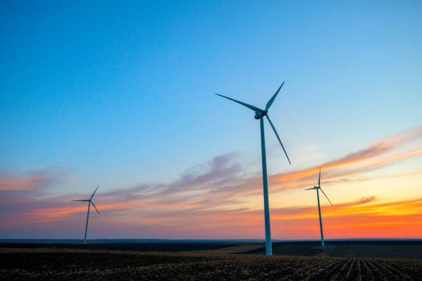 istock Windmills for electric power production at sunset 1315909719