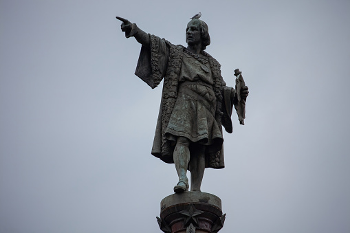 Barcelona, Spain - October 26, 2015: Columbus Monument on the square Portal de la Pau, at the lower end of La Rambla in Barcelona, Catalonia, Spain. Sculptor Gaieta Buhigas, 1888.