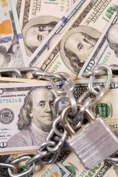 istock American paper currency under lock and chain. 1315918134