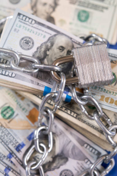 istock American paper currency under lock and chain. 1315918293