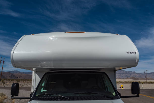 istock C-type camper with look at the top compartment standing in the desert 1315918319