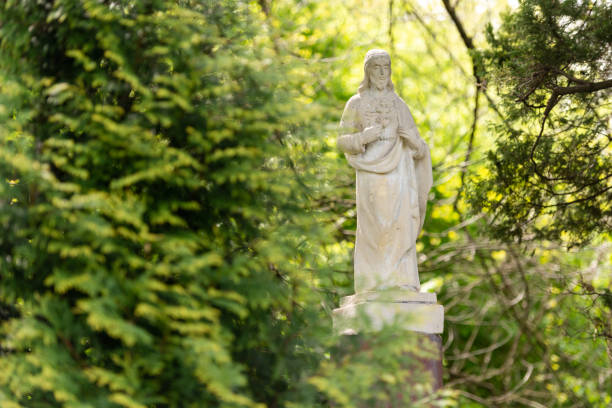 istock Statue of Jesus in the forest 1315928240