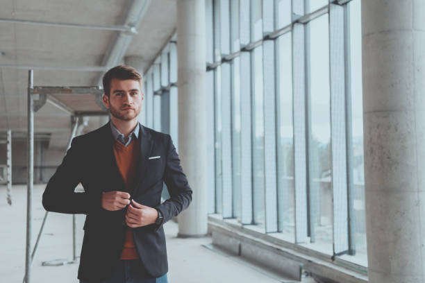 istock a successful entrepreneur oversees the construction site of startup office 1315928710