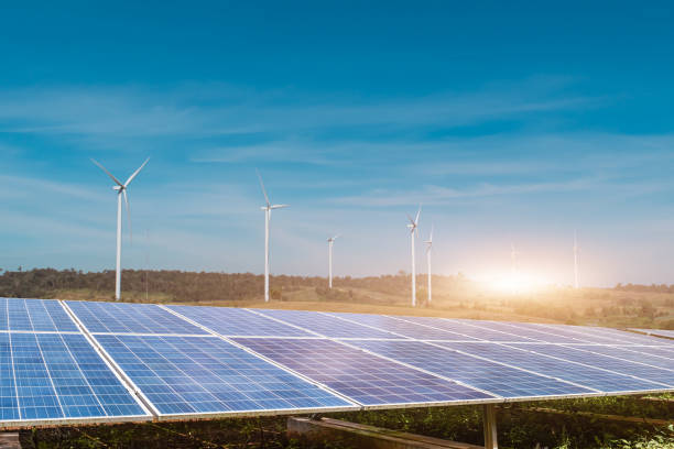 istock solar panels with wind turbines against blue sky background 1315936848