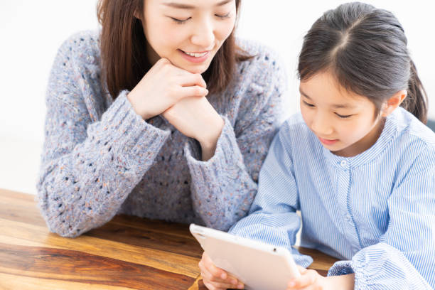 istock asian mother and daughter,tablet computer 1315939406