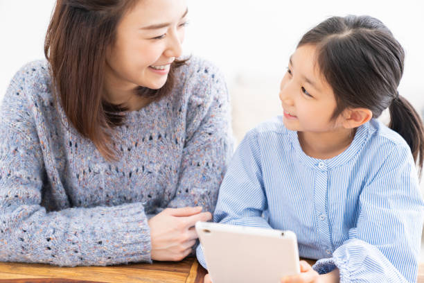 istock asian mother and daughter,tablet computer 1315939447