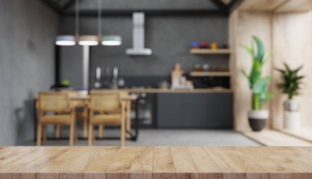 istock Wood table top on blur kitchen counter. 1315940212
