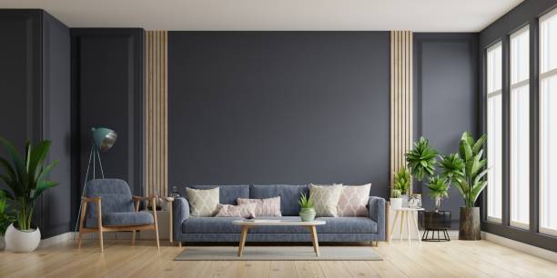 istock The interior has a sofa and armchair on empty dark wall background. 1315940258
