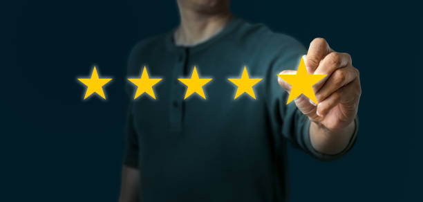 istock Excellent survey rating pressing on five star by man client. Panoramic of Customer satisfaction survey concept with copy space 1315954990