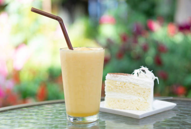 istock Closeup passion fruit smoothie and milk cake with green nature background, selective focus 1315960839