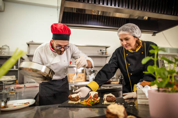 istock Chef serves the food on a plate 1315965115