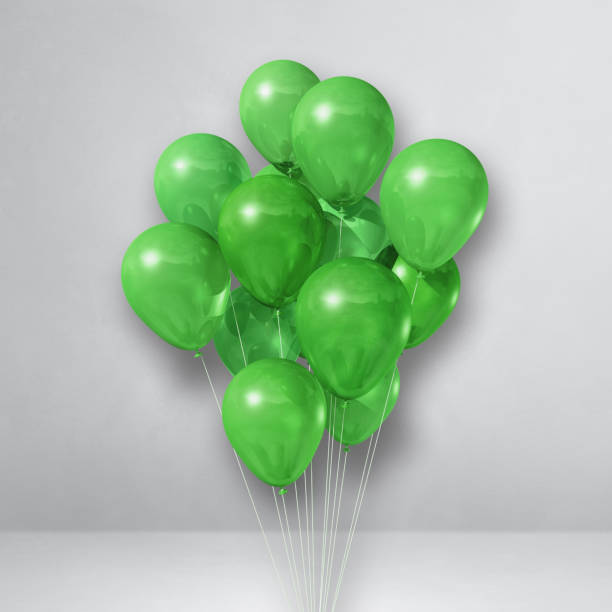 istock Green balloons bunch on a white wall background 1315969401