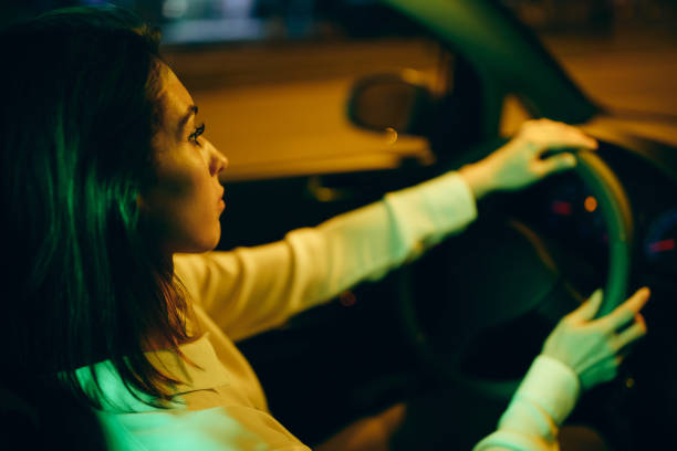 istock Pensive woman going on a trip by car at night. 1315976861