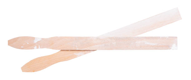 istock Old used stirring sticks isolated on white background 1315978306
