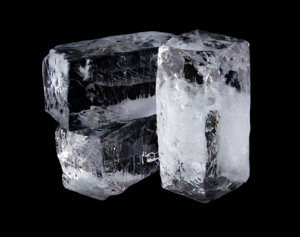 istock Large melting cube of clear ice on black background,Translucent ice block 1315980695