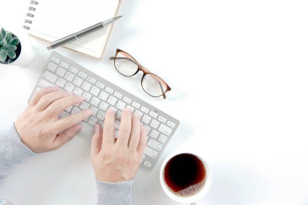 istock Businessman hands working on modern laptop. Office desktop on white background 1315983561