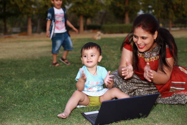 istock Mother and baby using laptop 1315988409