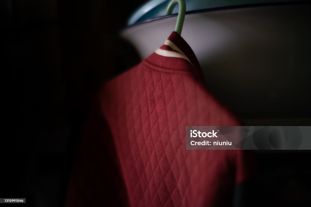 Clothes hanging on a hanger Arts Culture and Entertainment Stock Photo