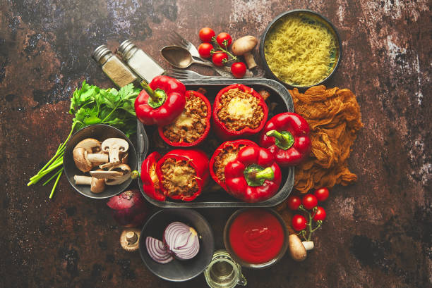 istock Red peppers stuffed with beef meet and mozarella cheese with herbs and garlic 1315992333