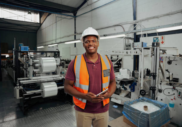 istock Happy african supervisor standing in warehouse holding digital tablet in hand 1315994836