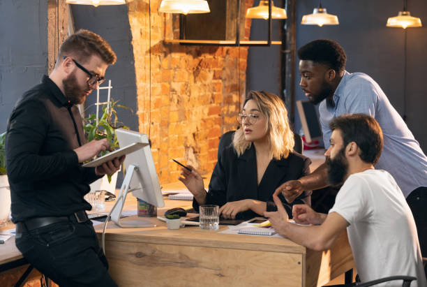 istock Colleagues working together in modern office using devices and gadgets during creative meeting 1315999935