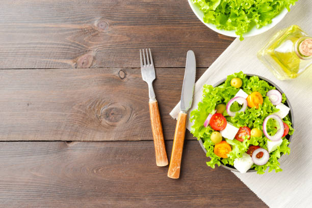 istock Vegetarian salad on wooden background with copyspace 1316001041