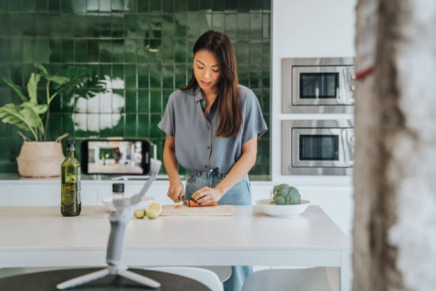 istock Female Chef preparing Food and Speaking on Camera for Vlog 1316001665