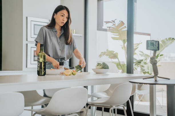 istock Female Chef preparing Food and Speaking on Camera for Vlog 1316001729