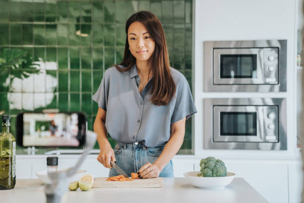 istock Female Chef preparing Food and Speaking on Camera for Vlog 1316001793