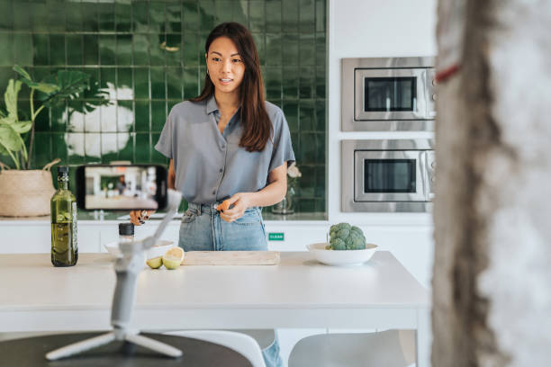 Female Chef preparing Food and Speaking on Camera for Vlog