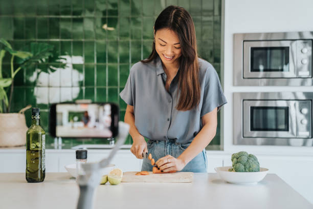 istock Female Chef preparing Food and Speaking on Camera for Vlog 1316001822