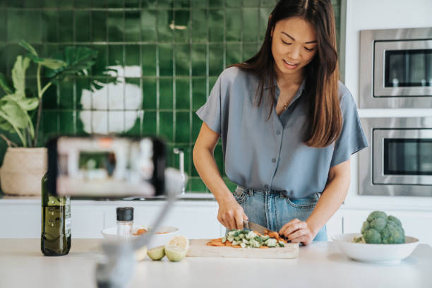 istock Female Chef preparing Food and Speaking on Camera for Vlog 1316001880