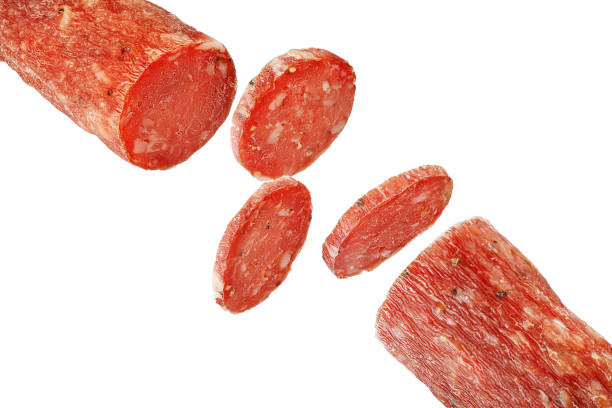 istock Dry meat sausage cutaway isolated on white background. 1316002693