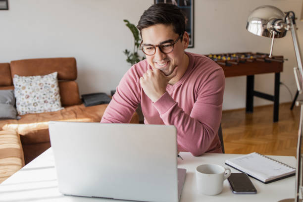 istock Young man working on the laptop at home 1316002701