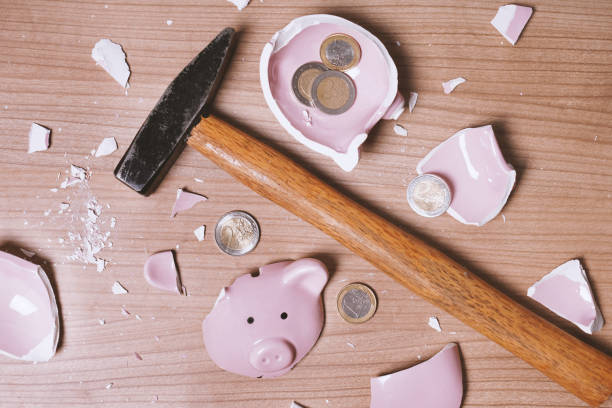 istock broken Piggy bank smashed into pieces with hammer and small chan 1316003024