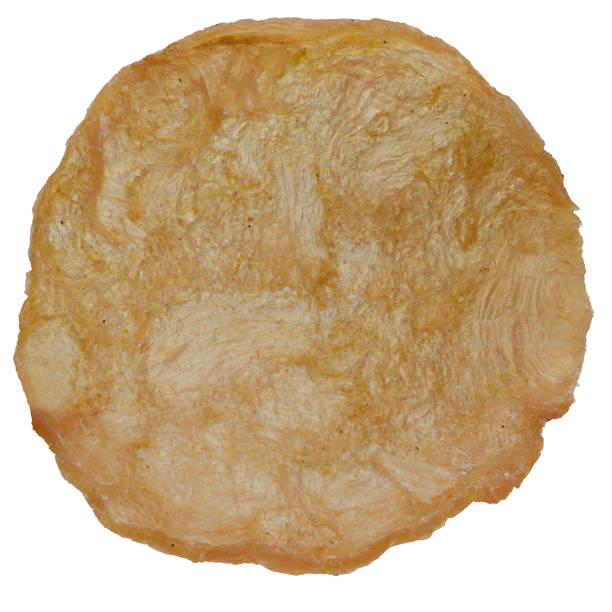 istock Meat chips close-up isolated on white, 1 piece. 1316004999