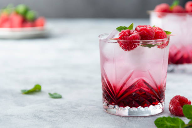 istock Raspberry cold drink cocktail with mint leaf and ice cubes. Summer fresh beverage in glass. Copy space. 1316005129