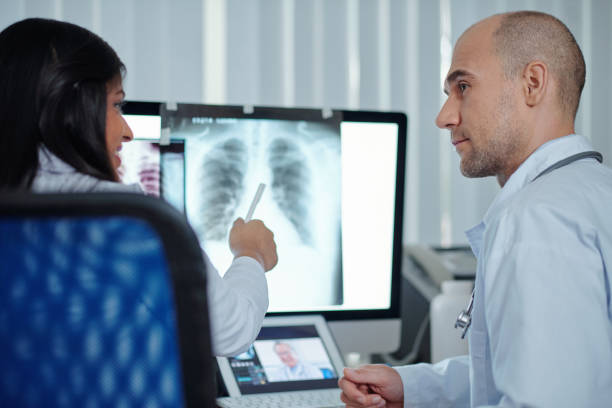 istock Business team discussing chest x-ray 1316005823