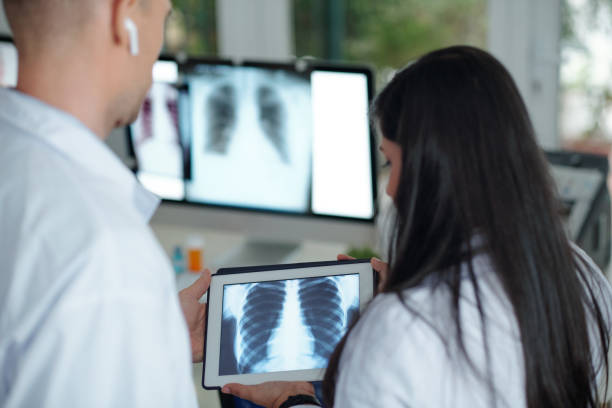 istock Surgeons discussing chest x-ray 1316005871