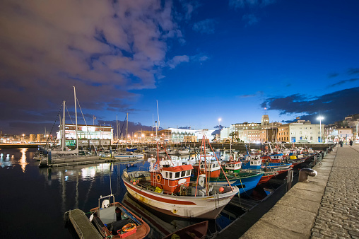 small fishing boats in the port of A Coruña, Galicia, Spain.