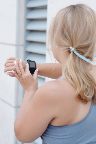 istock Sportswoman checking smartwatch 1316007161